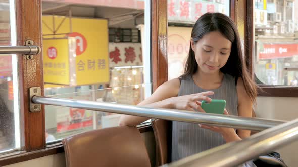 Woman taking the tram  alt