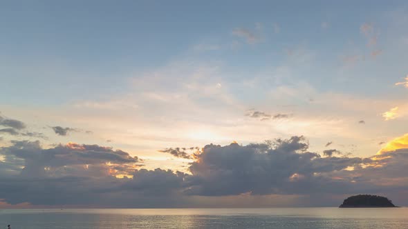 Time Lapse Colorful Clouds On The Calm Sea In The Evening. alt