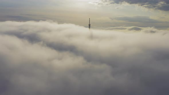 Aerial View of the Upper Part of the Broadcasting Tower in the Fog alt