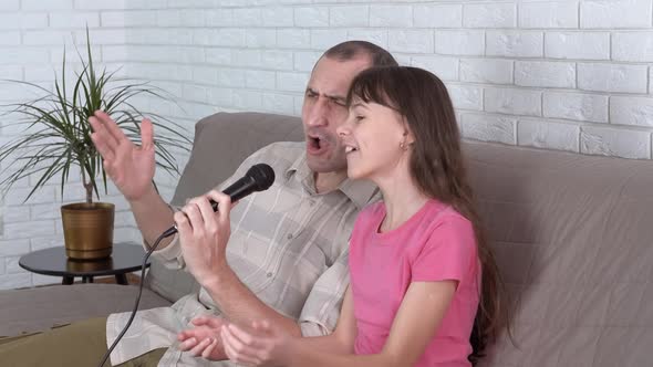 Sing with dad. Family karaoke.  alt
