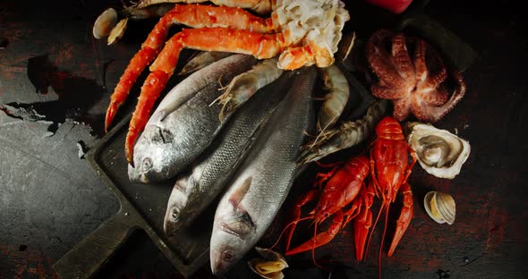 Fish and Seafood Rotate Slowly on the Cutting Board