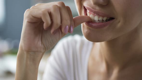 Woman Enthusiastically Gnawing Nails Attentively, Hearing Companion, Bad Habits alt