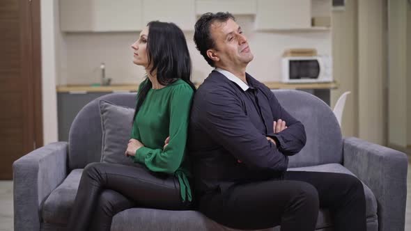 Argued Interracial Adult Couple Sitting on Couch Back to Back Talking Thinking alt