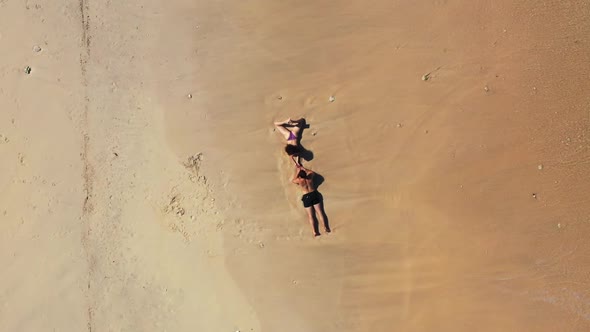 Two people suntan on idyllic island beach vacation by clear lagoon with white sandy background of Gi alt