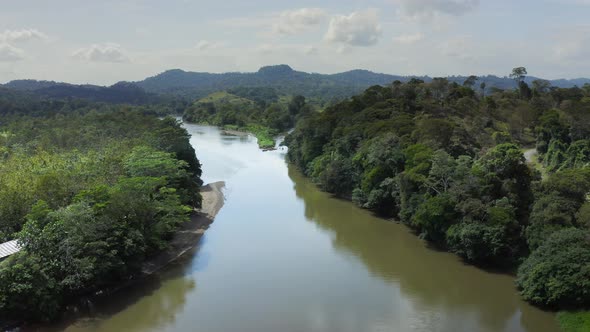 Aerial Drone View of Rainforest River and Mountains Scenery in Costa Rica at Boca Tapada, San Carlos alt