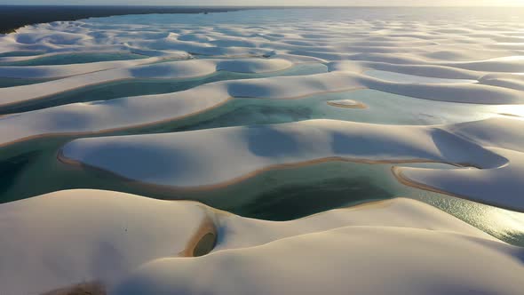 Sunset at Lencois Maranhenses Maranhao. Scenic sand dunes and rainwater lakes alt