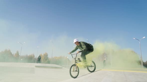 Man Riding Bmx Bicycle on Bowl at City Skate Park