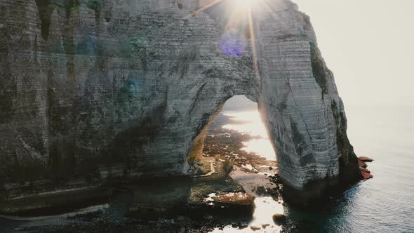 Drone Is Flying Away From Young Happy Tourist Newlywed Couple in Epic Natural Rocky Arch at Famous alt