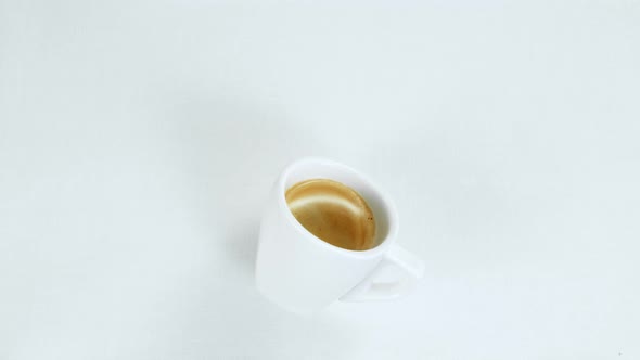 Super Slow Motion Shot of Spilling Coffee on White Cloth at 1000Fps alt