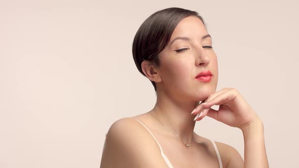 Beauty Brunette Model in Studio Alone with Ideal Shiny Skin Portrait alt