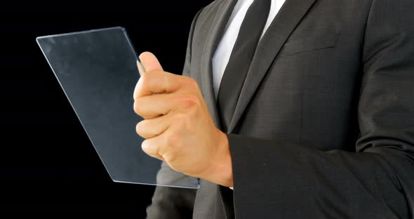 Businessman holding and touching a glass screen
