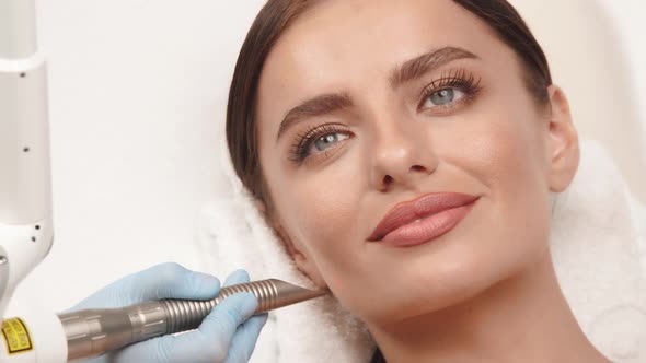 Woman Having Erbium Laser on Her Face at Spa alt