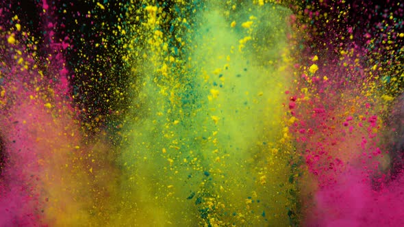 Super Slowmotion Shot of Color Powder Explosion Isolated on Black Background alt