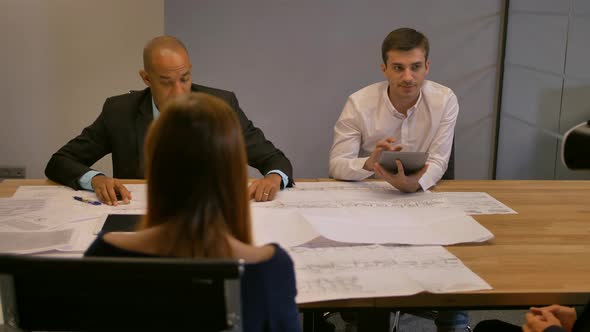 Atractive Entrepreneur in Virtual Reality Glasses. Group of Young Developers Working on Drawings in alt