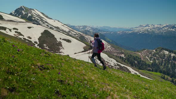 Woman Trekker Among Picturesque Mountain Landscapes alt