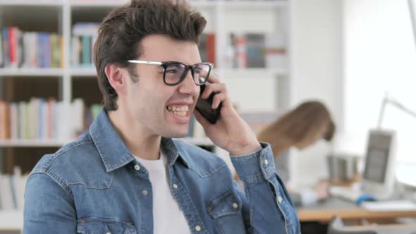 Angry Creative Man Yelling on Phone alt