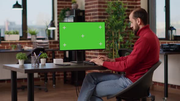 Financial Analyst Working with Green Screen on Computer alt