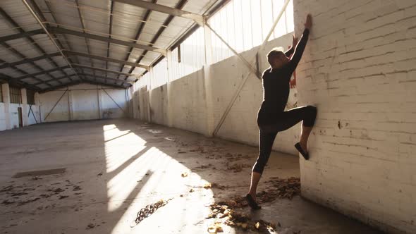 Male dancer in an empty warehouse alt