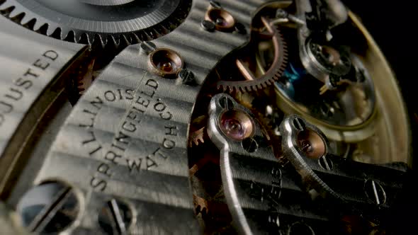 Antique Pocket Watch Mechanism Moving on Isolated Black Studio Background alt