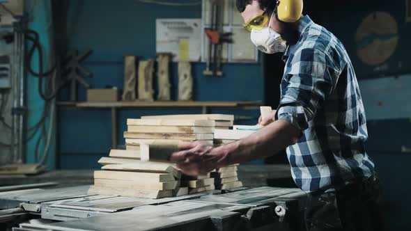 A Man Works with a Planer alt