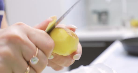 Cleaning Potatoes with a Knife alt