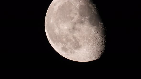 Real moon telescopic shot with super tele lens. rotating Moon with surface detail alt