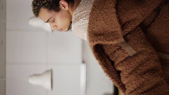 A Man in a Dress and Fur Coat Sensually Dancing on the Kitchen Close Up alt