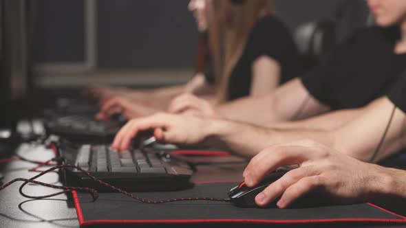 Team of eSport Diverse Gamers Playing Video Games on a Cyber Game Contest. alt