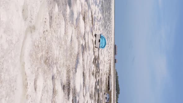 Vertical Video of Low Tide in the Ocean Near the Coast of Zanzibar Tanzania Aerial View alt