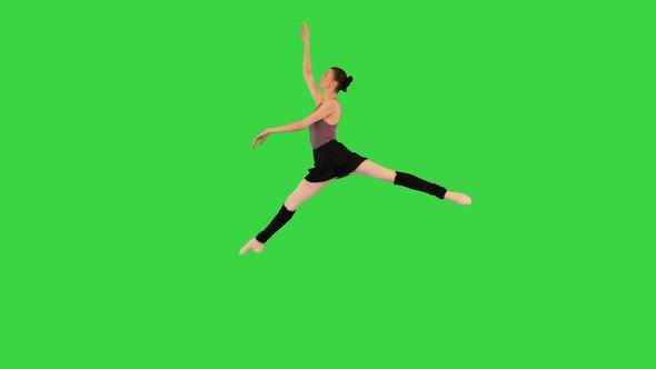 Young Ballerina Training a Jump on a Green Screen Chroma Key alt