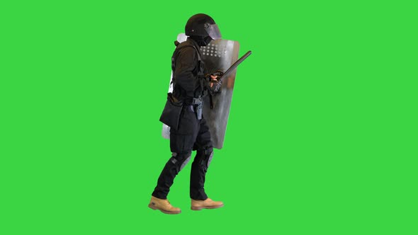 Policeman in Full Uniform Running with a Shield and Baton on a Green Screen Chroma Key alt