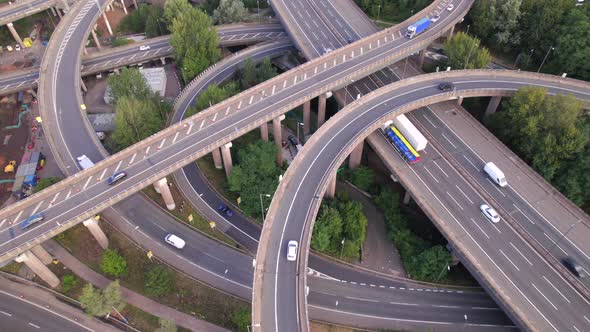 Vehicles Driving Navigating a Spaghetti Interchange Road System alt