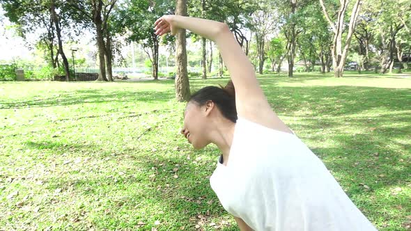 oung asian woman yoga outdoors keep calm and meditates while practicing yoga. alt