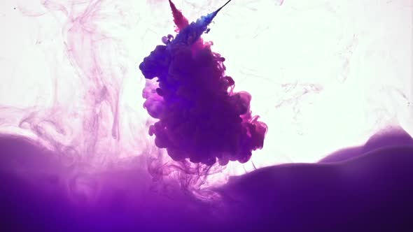 Abstract Of Blue Liquid Into Purple