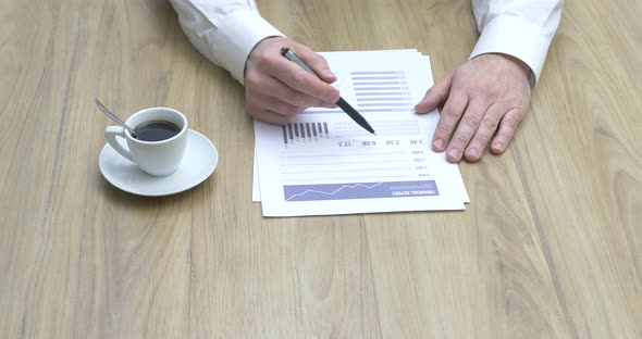 Businessman checking financial reports