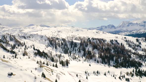 Aerial, Beautiful View On Snowy Dolomites Mountains, Huge Peaks And Ski Tracks