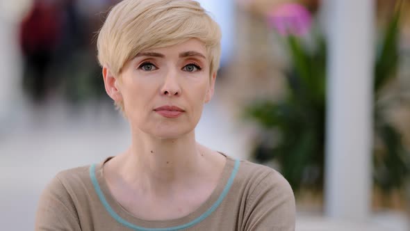 Female Indoor Portrait Beautiful Mature Middleaged Woman Blonde with Short Hair Wrinkled and Natural alt