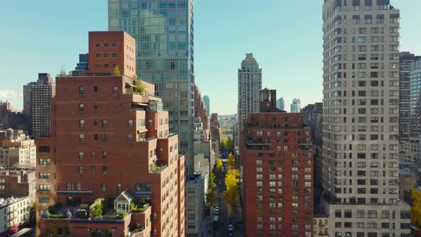 Forwards Fly Above High Rise Buildings in Residential District alt