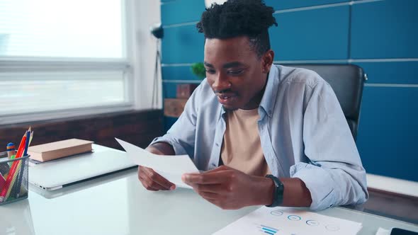 Young African American Man Reading Contract Happy to Receive Offer Company alt