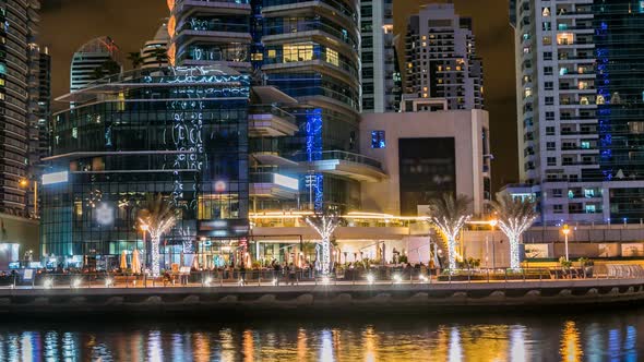 View of Dubai Marina Towers and Canal in Dubai Night Timelapse alt