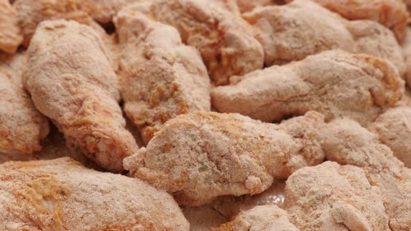 Raw chicken meat arranged and ready to being baked close-up 4K 2160p 30fps UltraHD tilting footage - alt