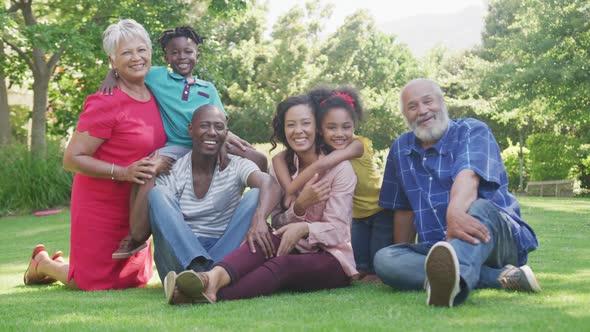  Multi-generation African American family spending time in the garden together alt