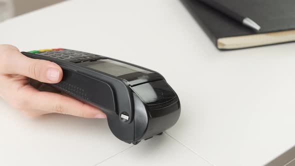 Close Up Man Hand Contactless Paying By Credit Card Using Pos Terminal alt