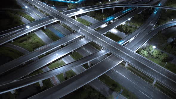 Aerial view shot of fast moving above interchange and multi junction road alt