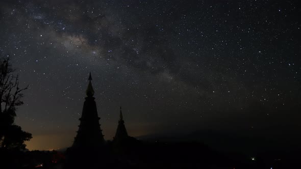 Time lapse of milky way over two pagoda at Doi Inthanon mountain nation park - Chiang Mai,Thailand alt