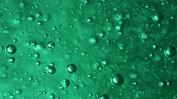 Slowly Moving Bubbles in Green Gel