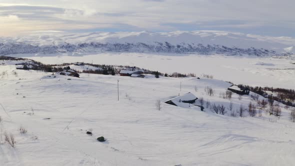 Amazing White Mountain View In Huagastol Norway In Winter - aerial shot alt