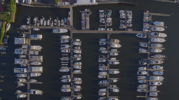 Top Down Rising Aerial View of Boats Docked at a Marina in Port Washington alt