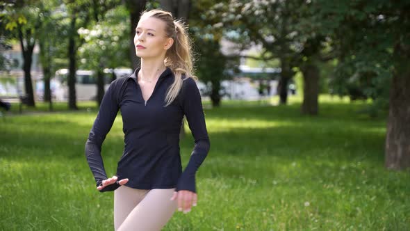Woman in Sportswear Practicing Yoga in Park