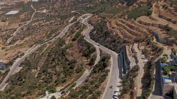 Beautiful hillside curvy road to Falasarna beach in Crete island, aerial drone view alt